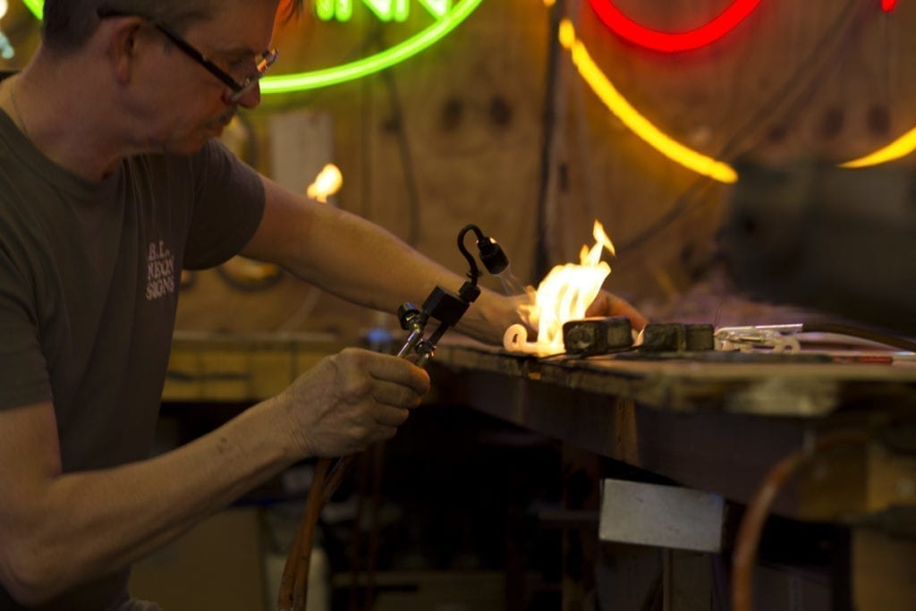 Ciaran Larkin BL Neon blowing glass neon with a flame
